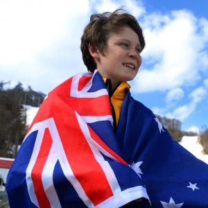 An image of Ben Tudhope carrying the Australian flag