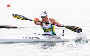 Image of a female athlete in action during para-canoeing