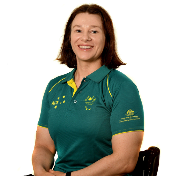 Australian Paralympian Susan Seipel, wearing a green polo shirt, smiling at the camera.