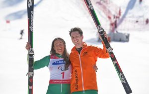 An image of Melissa Perrine and Christian Geiger smiling