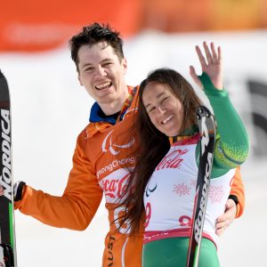 An image of Melissa Perrine and Christian Geiger smiling