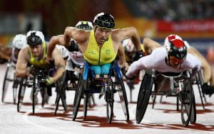 An image of Kurt Fearnley participating in athletics with other parathletes