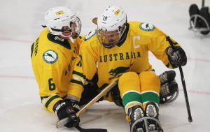 An image of players in a para-ice hockey match