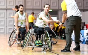 An image of para-athletes during a game of wheelchair basketball