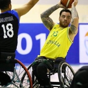 An image of a para-athlete in a match of wheelchair basketball