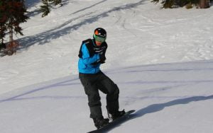 An image of Matt Robinson in action while snow boarding