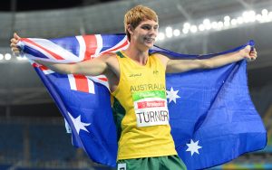 Image of James Turner holding Australian Flag