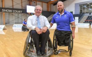 Scott Morrison and Ryley batt smiling in wheelchairs