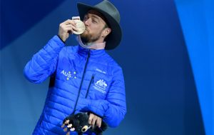 male paralympian kissing gold medal