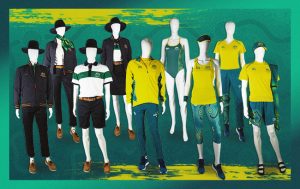 Image featuring a green background and 9 mannequins dressed in a variety of uniforms to be worn by the Australian Paralympic Team at the Tokyo 2020 Paralympic Games.