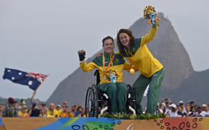 Liesl Tesch and Dan Fitzgibbon on the medal podium with a gold medal
