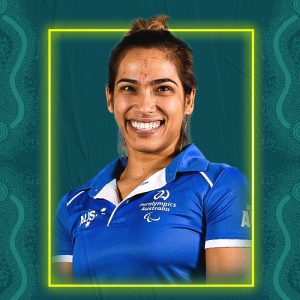Image containing a dark green background with a yellow border. In the middle is a headshot of Australian para-athlete Madison de Rozario looking straight at the camera. She is wearing a blue t-shirt.