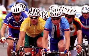 Daniel Polson cycling with other Paralympians