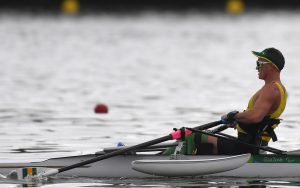 Australian Paralympian Erik Horrie rowing on the water