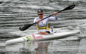 Image of a female in a canoe paddling on the water