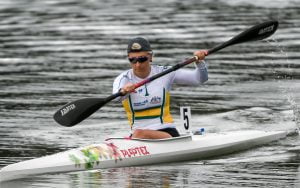 Image of a female in a canoe paddling on the water