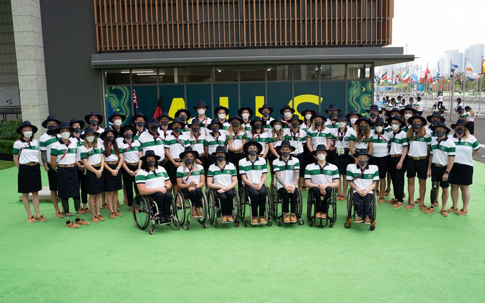 The Tokyo 2020 Paralympic Games Australian Para-athletics Team wearing their Tokyo 2020 Paralympic Games Opening Ceremony uniforms and smiling at the camera.