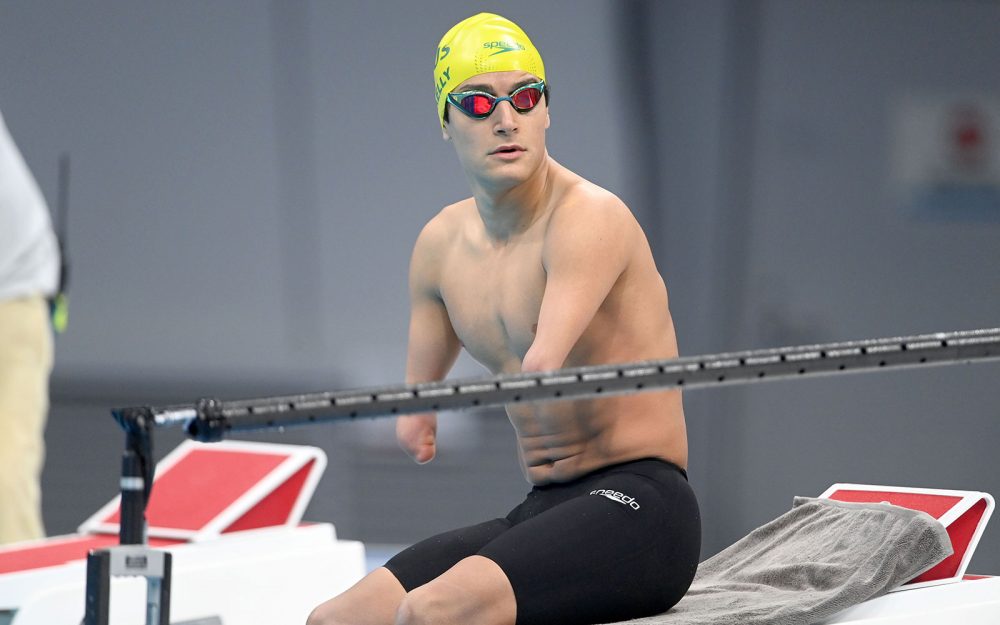 Male Australian Para-swimmer Ahmed Kelly waiting on the blocks in Tokyo.