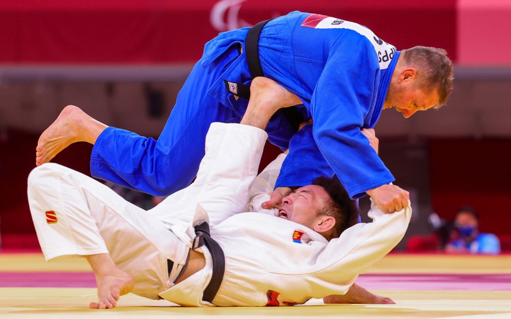 2 judo competitors compete in a bout