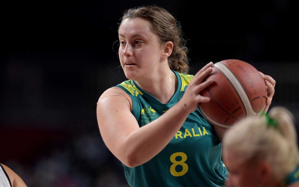 Female wheelchair basketball player looking to pass the ball
