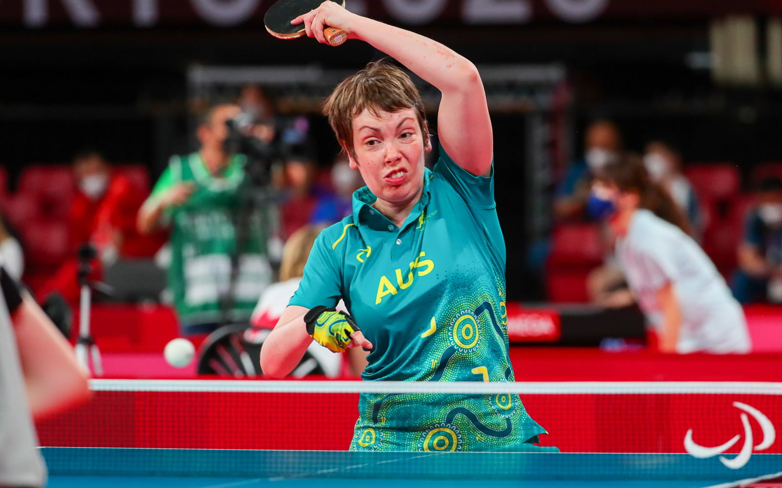 Female table tennis player hitting a shot