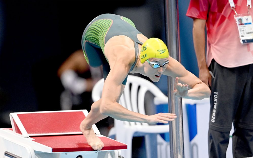 Australian Paralympian Ellie Cole diving off the blocks to start a swimming race