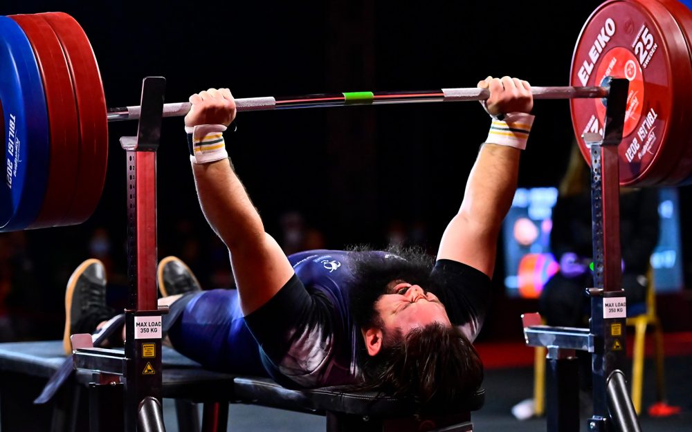 A male Australian athlete powerlifting