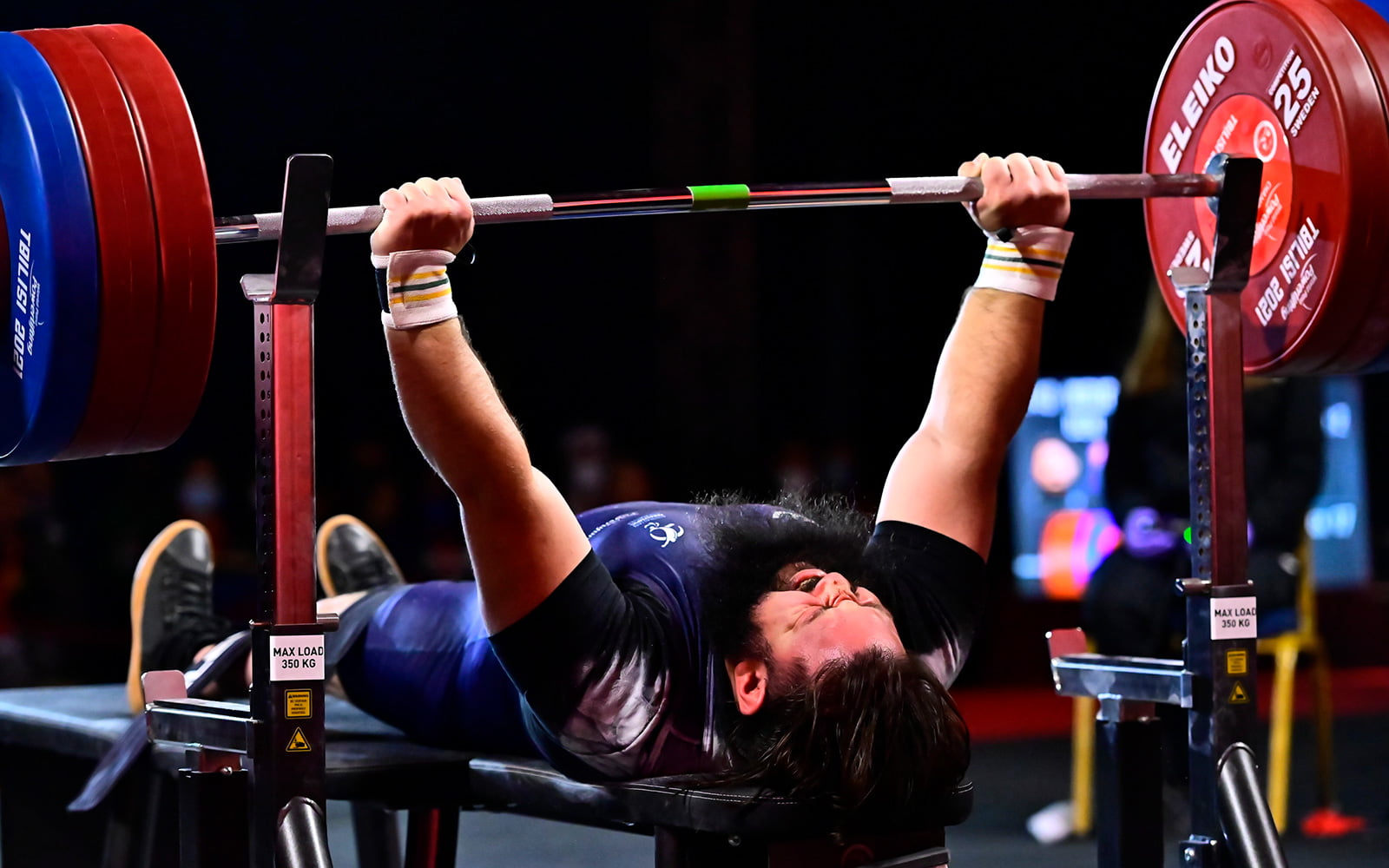 A male Australian athlete powerlifting
