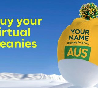 On the right of the image is a gold beanie with a green and gold pom pom on the top. On the front of the beanie are the words "your name" and AUS. To the left of the beanie, the text reads: buy you virtual beanies.