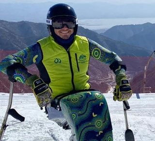 Australian Paralympian Sam Tait in his Beijing 2022 team uniform and sit ski