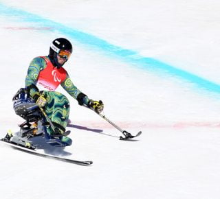 Australian Paralympian Sam Tati sit skiing at the Beijing 2022 Paralympic Winter Games.