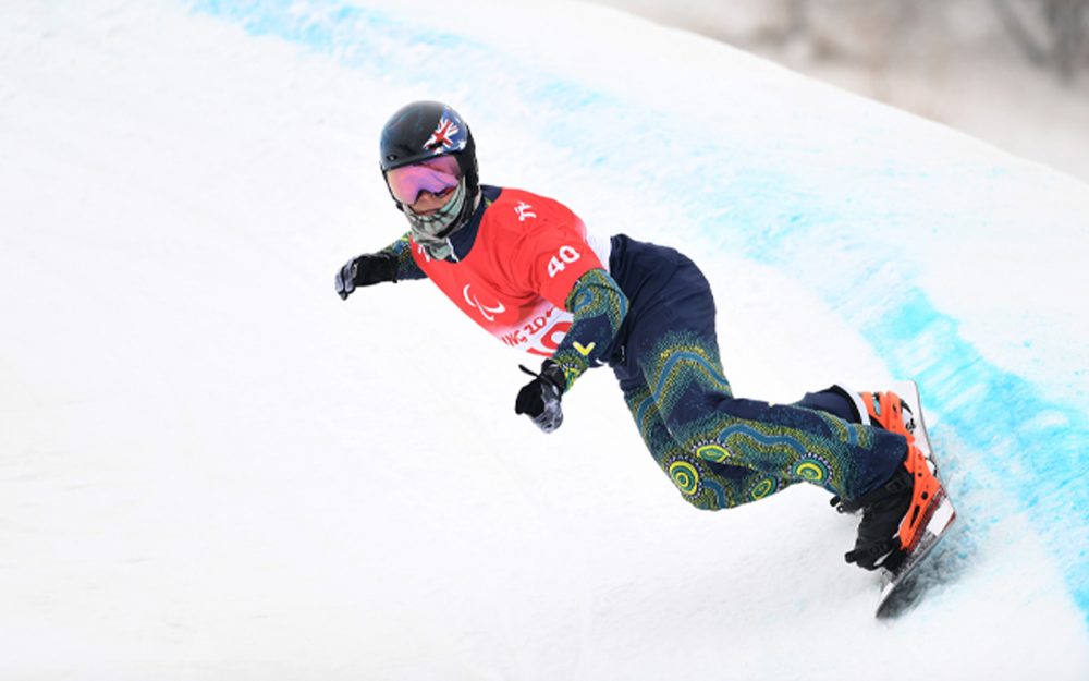 Australian Paralympian Ben Tudhope snowboarding the Banked Slalom at Beijing 2022