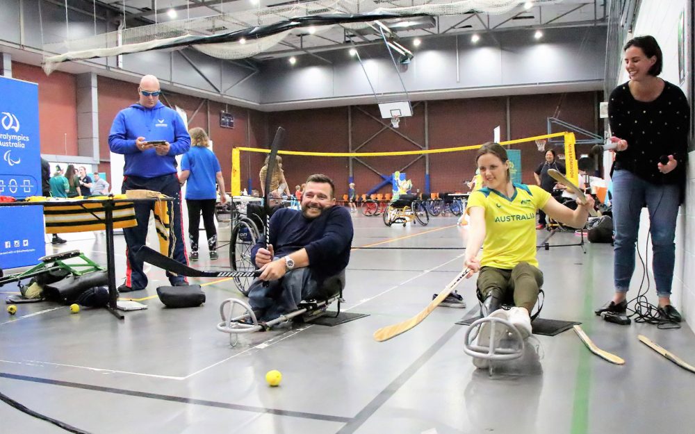 Kurt Fearnley and Ellie Cole trying Para-ice hockey at a Come & Try Day in Sydney.