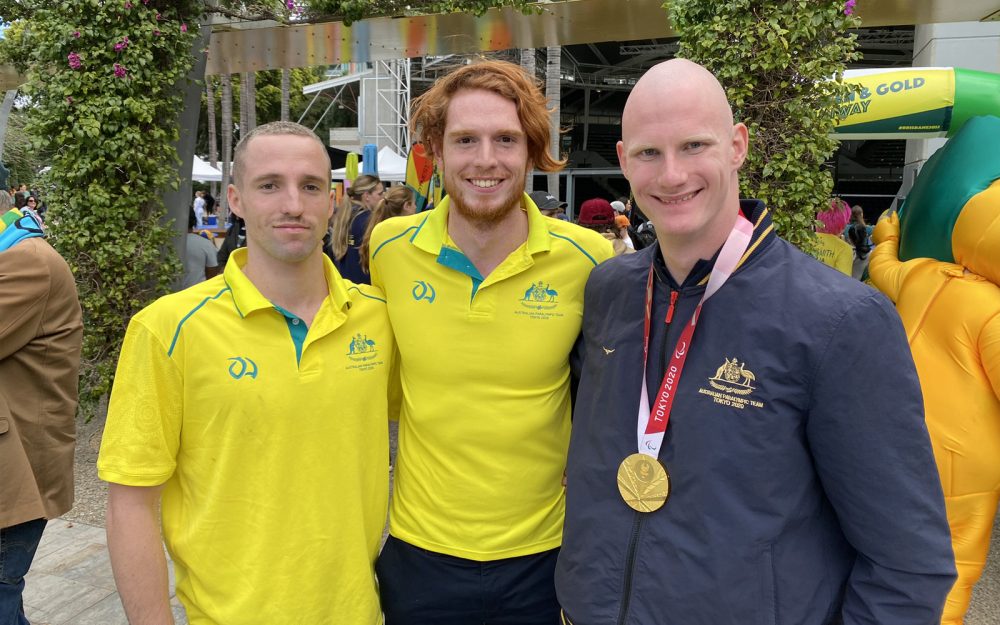 Australian Paralympians Tom Gallagher, Jake Michel and Rowan Crothers smiling for a photo