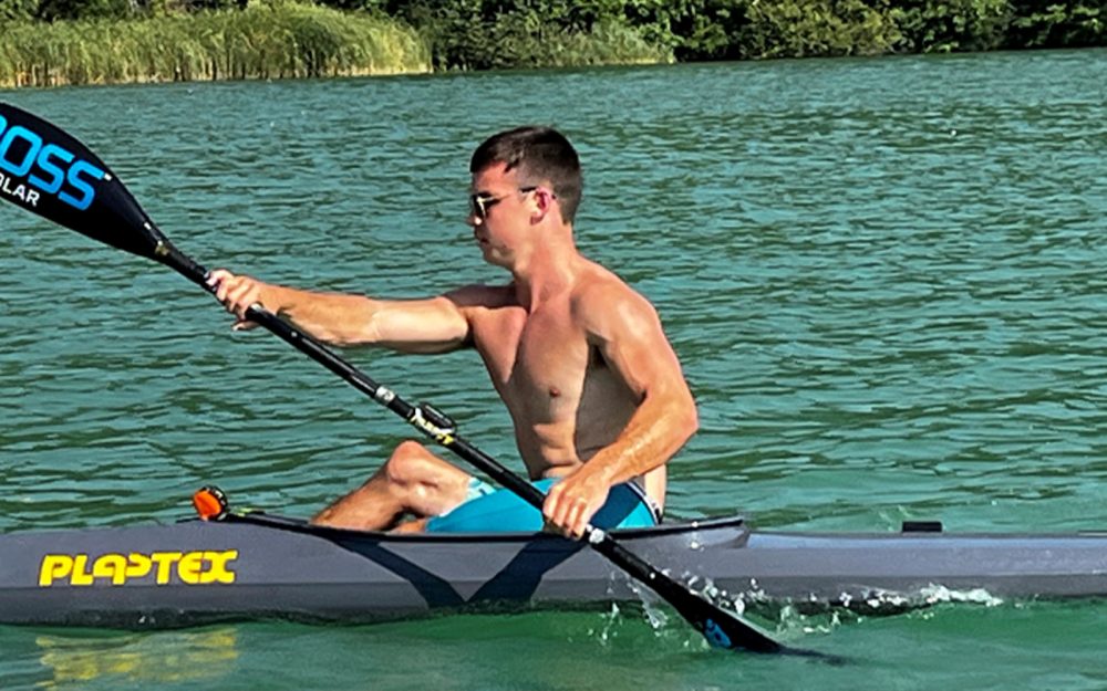 Australian Paralympian Dylan Littlehales canoeing shirtless.