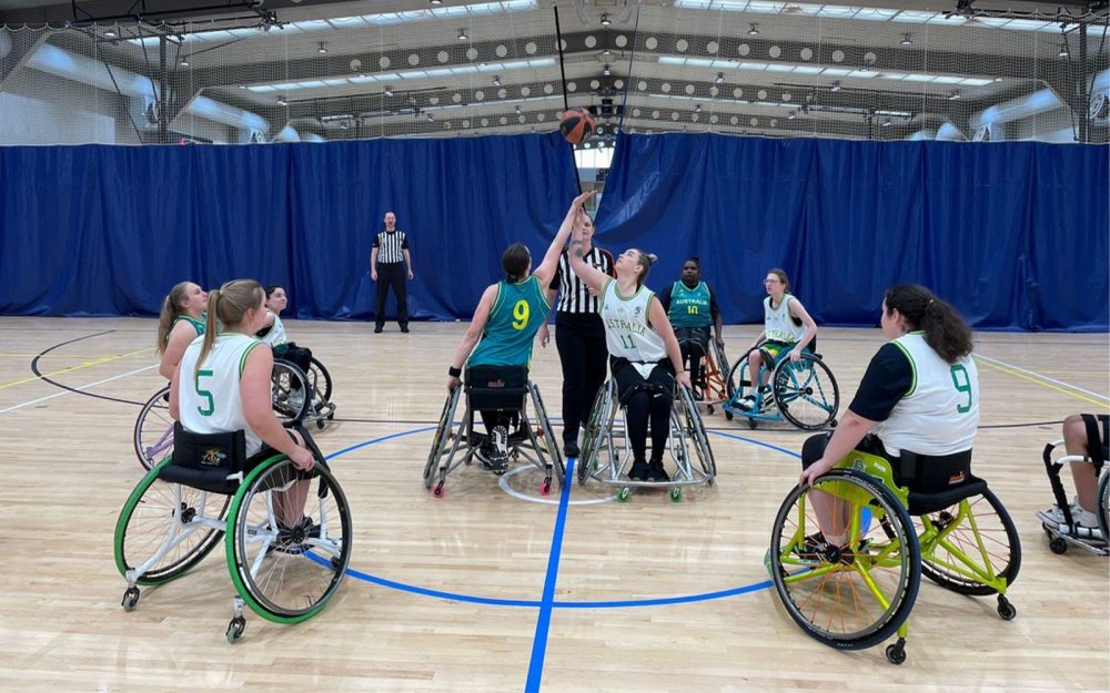 Female athletes playing Wheelchair basketball.