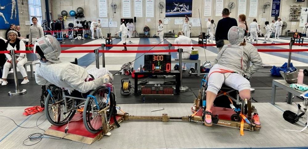 Athletes competing in Wheelchair fencing.
