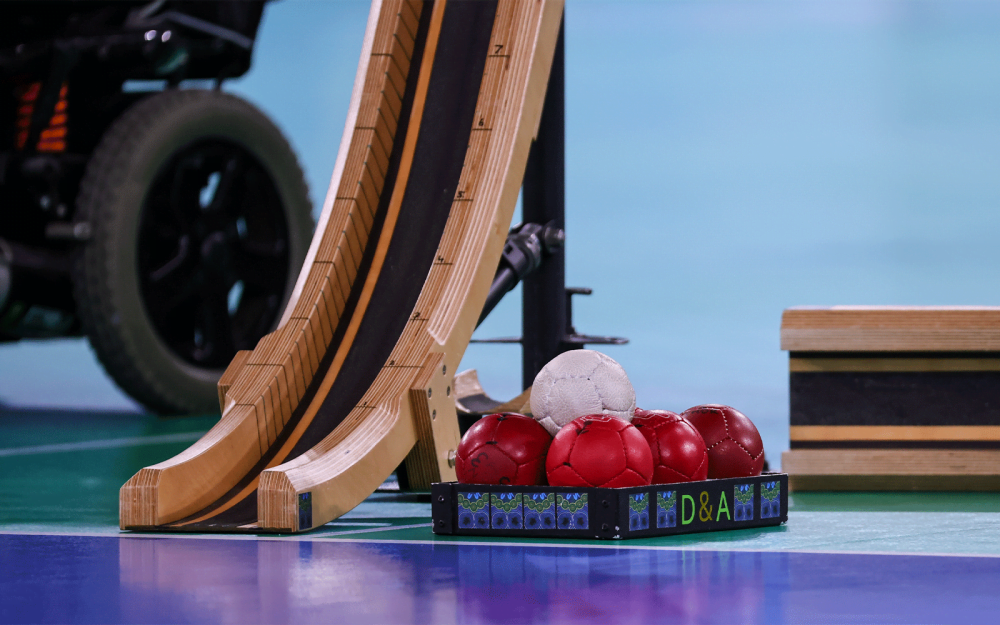 A zoomed in shot of Boccia balls and a Boccia ramp.
