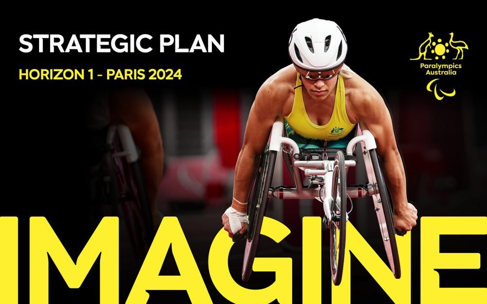 The front cover of the Paralympics Australia Strategic Plan featuring Paralympian Madison de Rozario in her racing chair. She is wearing her green and gold Australian team uniform, with a white helmet and reflective glasses. Text on image reads: Strategic Plan Horizon 1 - Paris 2024 Imagine. The new Paralympics Australia logo is on the left.