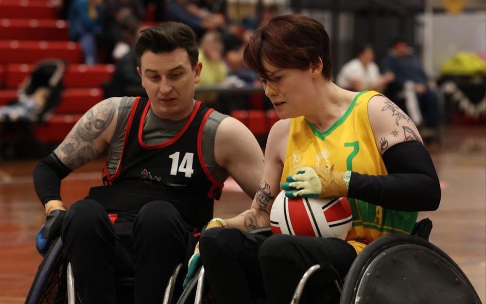 Australian Wheelchair Rugby player Robyn Lambird in action. There is an opposition player approaching.