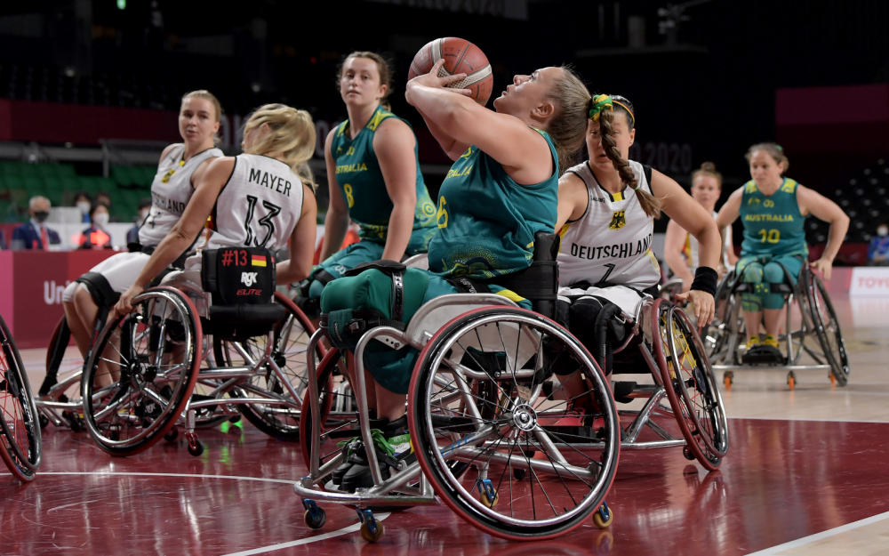 Bridie Kean with basketball in hand on court.
