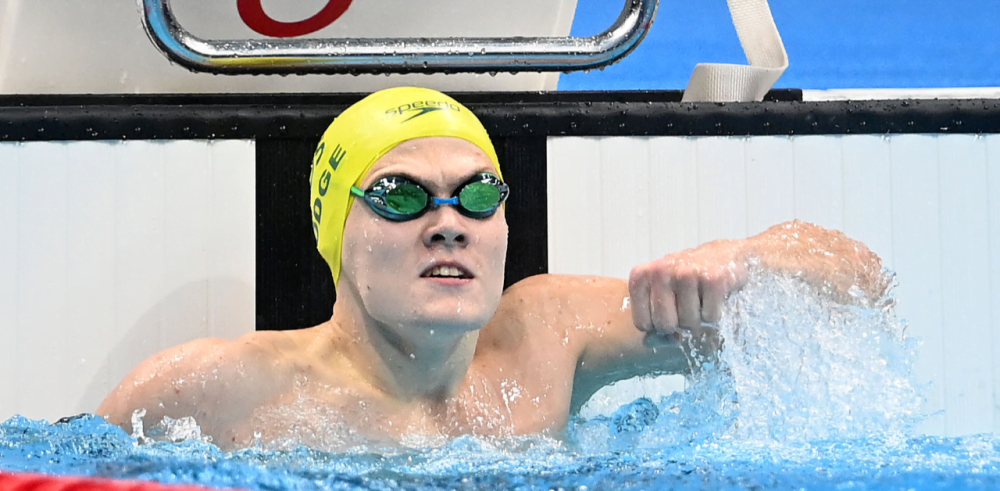 Tim Hodge in swimming pool facing camera.