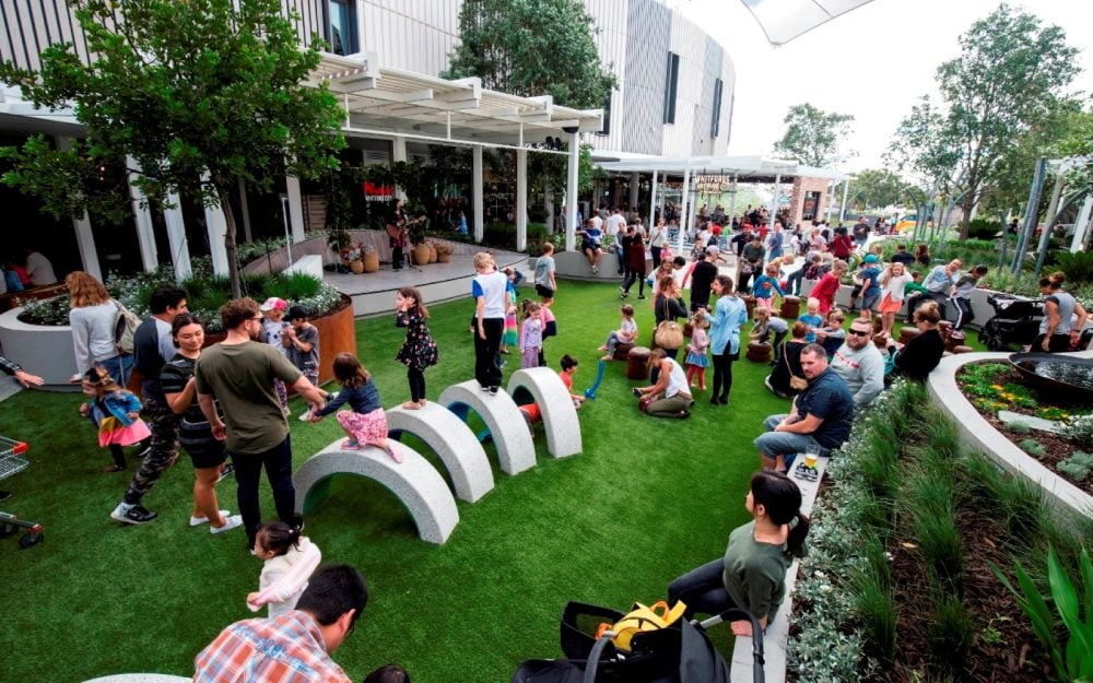 People enjoying the open air area at Westfield Whitford City.