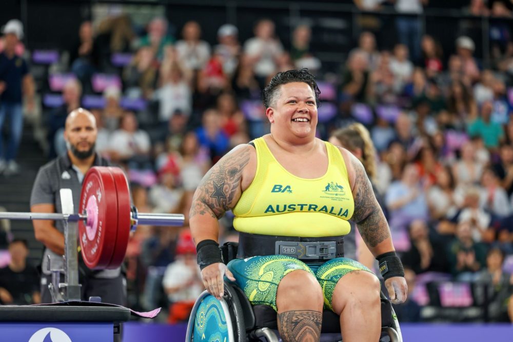 Hani Watson smiles at the crowd as she prepares to compete in para-powerlifting on the final day of the Paralympic Games.