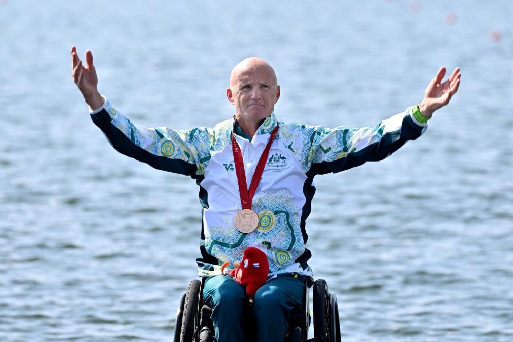 Para-rower Erik Horrie celebrates his bronze medal win.