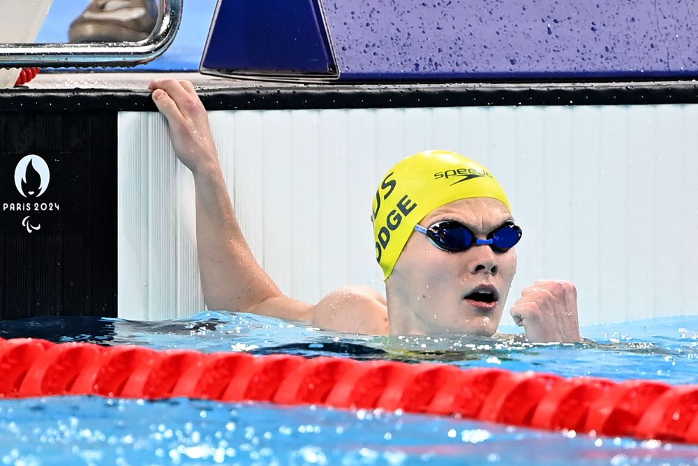 Timothy Hodge reacts at the end of the pool after winning gold in the Men's 200m Individual Medley.