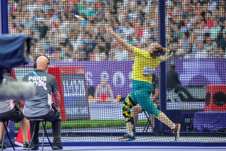 Paralympian Sarah Edminston mid-throw in competition at the Paris Paralympic Games.
